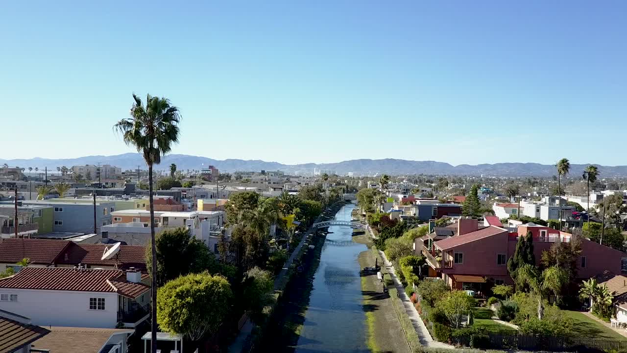 Tracking shot of the Venice canals at Venice Beach, California