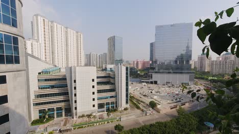 time-lapse in gurugram with business district overlooking skyline and traffic on a clear day with blue skies