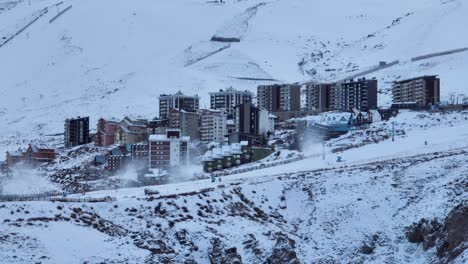 aerial establishing shot of the el colorado ski resort with slopes and a village