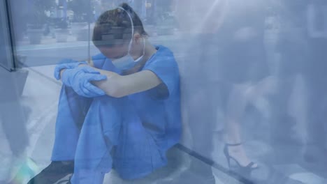 animation of a doctor sitting in a hospital hallway over people walking on a street.