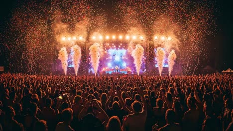a night of energy and celebration: spectacular fireworks and enthusiastic crowd at an electrifying music festival performance
