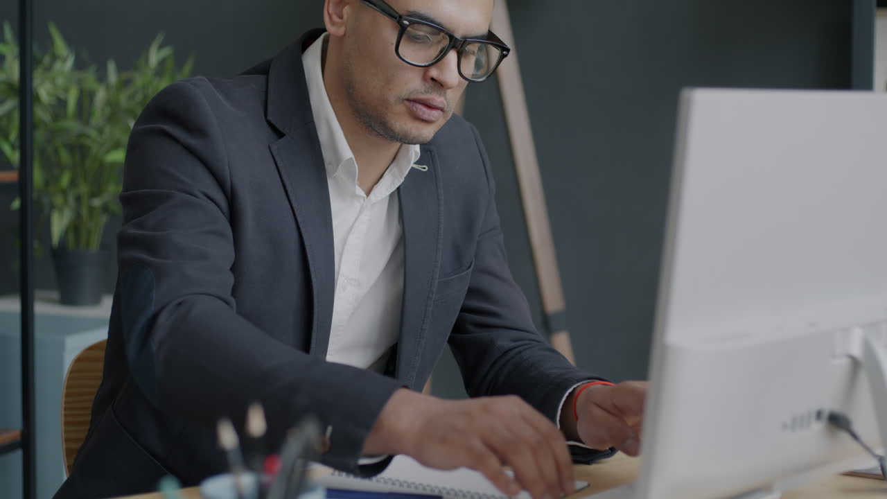 Businessman working at computer in office