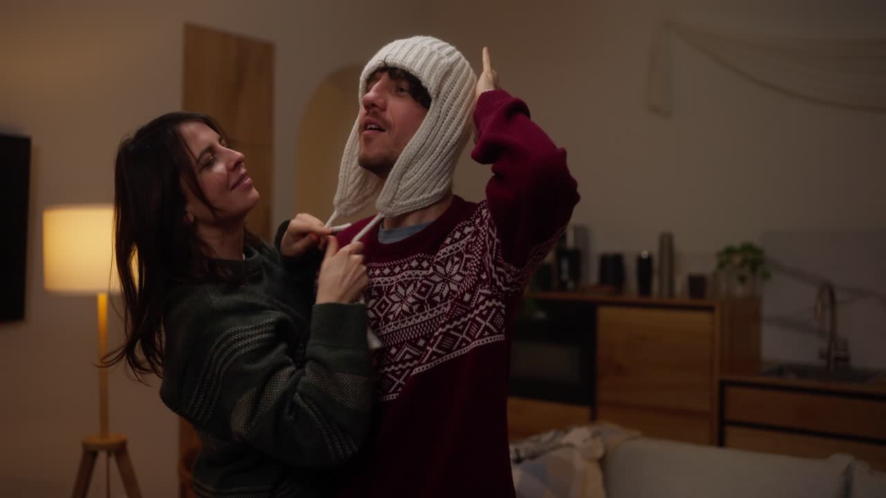 Couple Wearing Winter Hats at Home