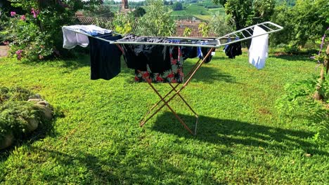 clothes drying on rack in scenic vineyard