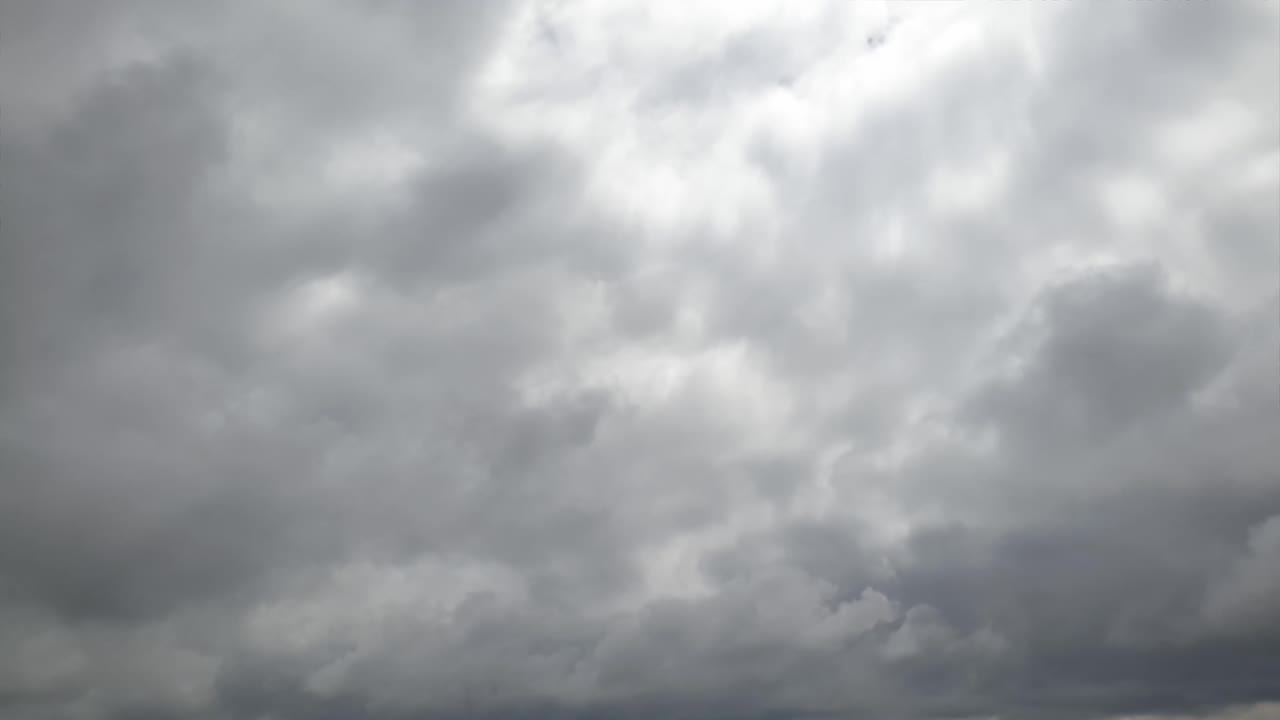 Mid afternoon thunderstorm rain clouds forming and blending across the african horizon time lapse, noise free 4k footage