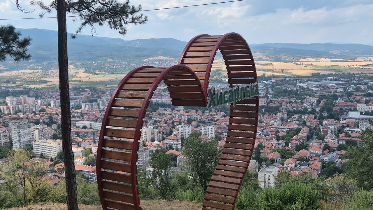 Panoramic view from a wooden heart of Hisarlaka towards the town of Kyustendil