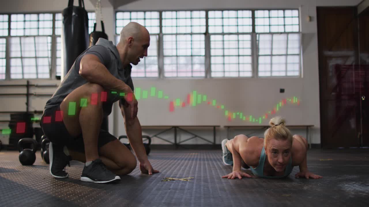 Trainer cueing woman performing push-ups for coaching, candlestick graph sweeping over gym floor