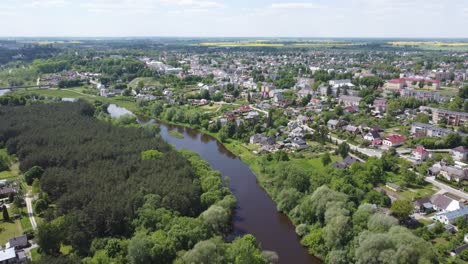 aerial ascending flying away shot of ukmerge, lithuania