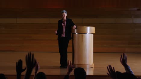 female business executive giving a speech