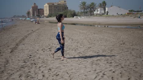 woman walking on a sandy beach