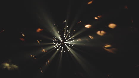 dark club underground disco ball spinning in the light shining in kyoto, japan