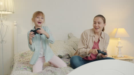 mother and daughter playing video games