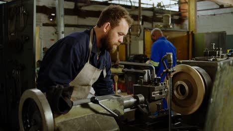 metalsmith working in workshop 4k