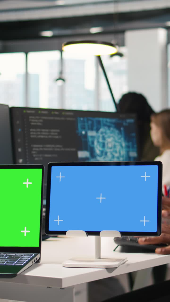 Vertical video Software developer using AI on isolated screen laptop and tablet