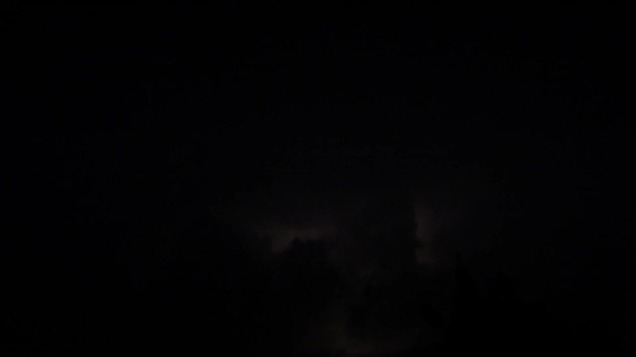 Lightning Streaks Across the Sky in a Thunder-Filled Night