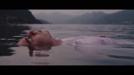 man floating on lake