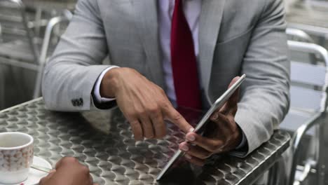 Cropped-shot-of-young-businessman-using-tablet