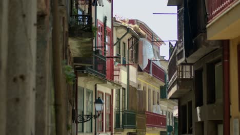 some balconies by a narrow street in porto, portugal