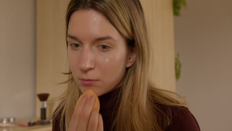 Girl-doing-makeup-on-herself-at-home