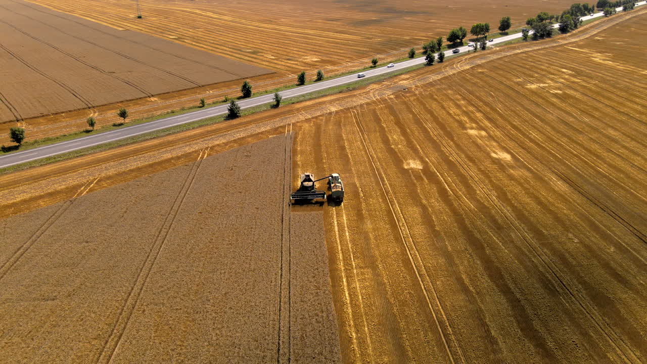 Combine harvester Polish farming. Pull Out aerial reveal