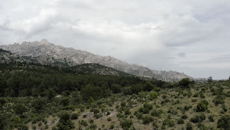 very cinematic pull out over the foothills of the sierra de guadarrama mountain ranges in the parque nacional de la pedriza near manzanares el real spain