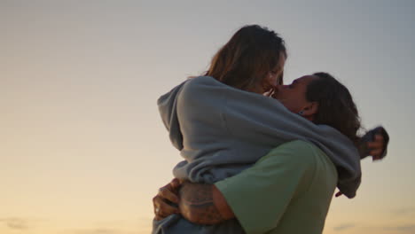 couple enjoying sunset beach