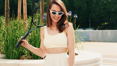 woman playing tennis in a park
