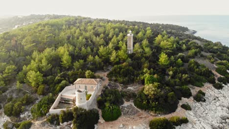 famous venetian lighthouse and byzantine bascilica in kefalonia greece - aerial shot