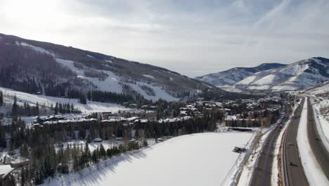 drone shot of a busy highway and a ski resort in colorado