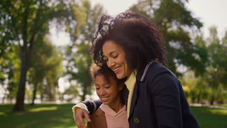 Joyful-mother-making-selfie-in-park-portrait.-Gentle-relations-between-mom-kid.