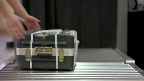 luggage being scanned at airport security.