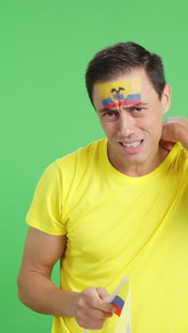 Man cheering for Ecuador during a match that is lost