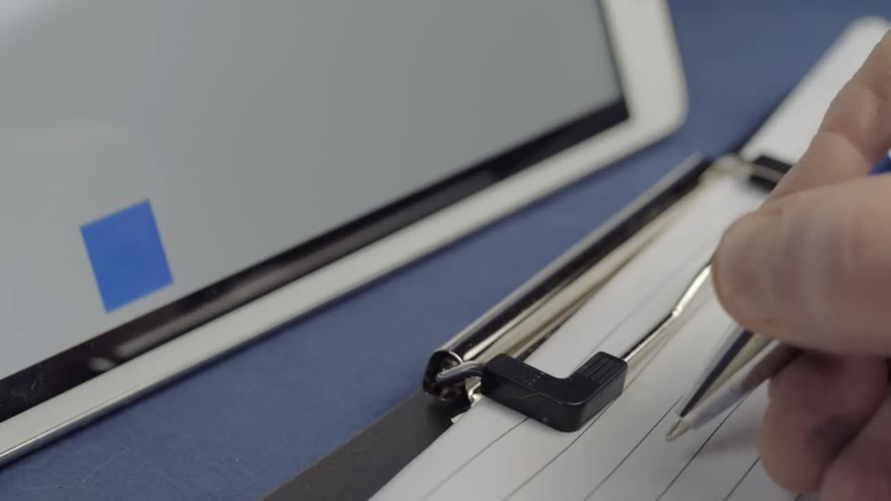 Writing sales report with blue graph in background