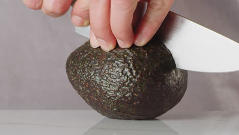 Slicing-an-avocado-in-half