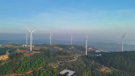 wind turbines on the mountain in the beautiful sunrise morning - vietnam
