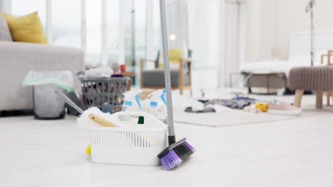 empty living room, broom and cleaning equipment