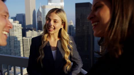 multi ethnic management team meeting on chicago rooftop