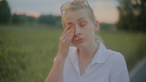 yawning woman at sunset