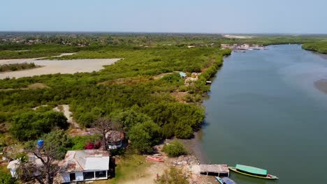 Beautiful-aerial-view-of-river-Gambia-and-the-Atlantic-Ocean-shot-at-Stala-Adventures,-Kartong---The-Gambia