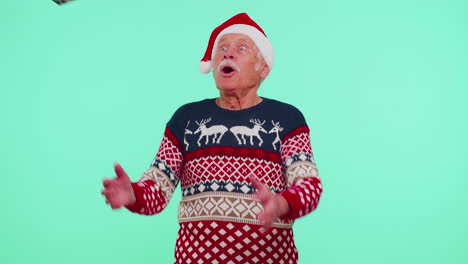 Grandfather-man-in-sweater-Santa-Christmas-getting-present-gift-box,-expressing-amazement-happiness