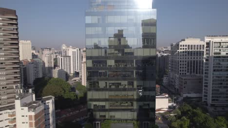 Drone-goes-down-in-front-a-mirrored-business-building