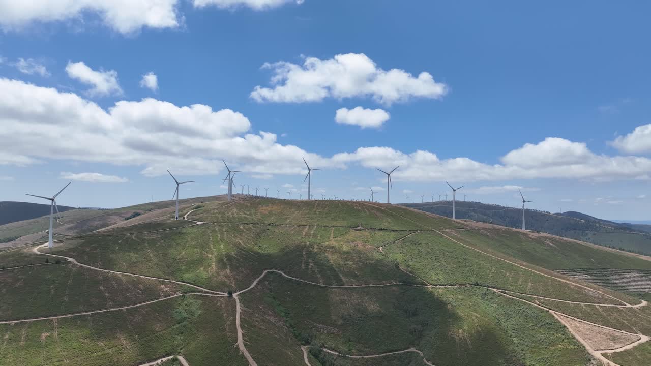 Large windmill farm on hills in Portugal.