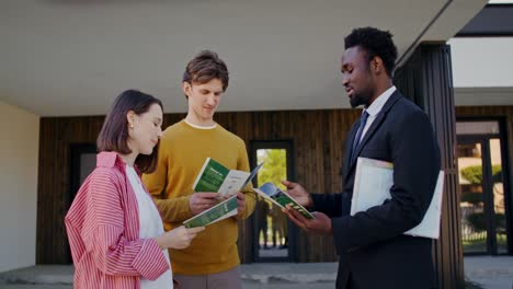 real estate broker discussing property with clients