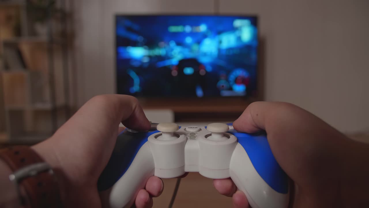 Hands Gamer Playing Car Race Game On Tv