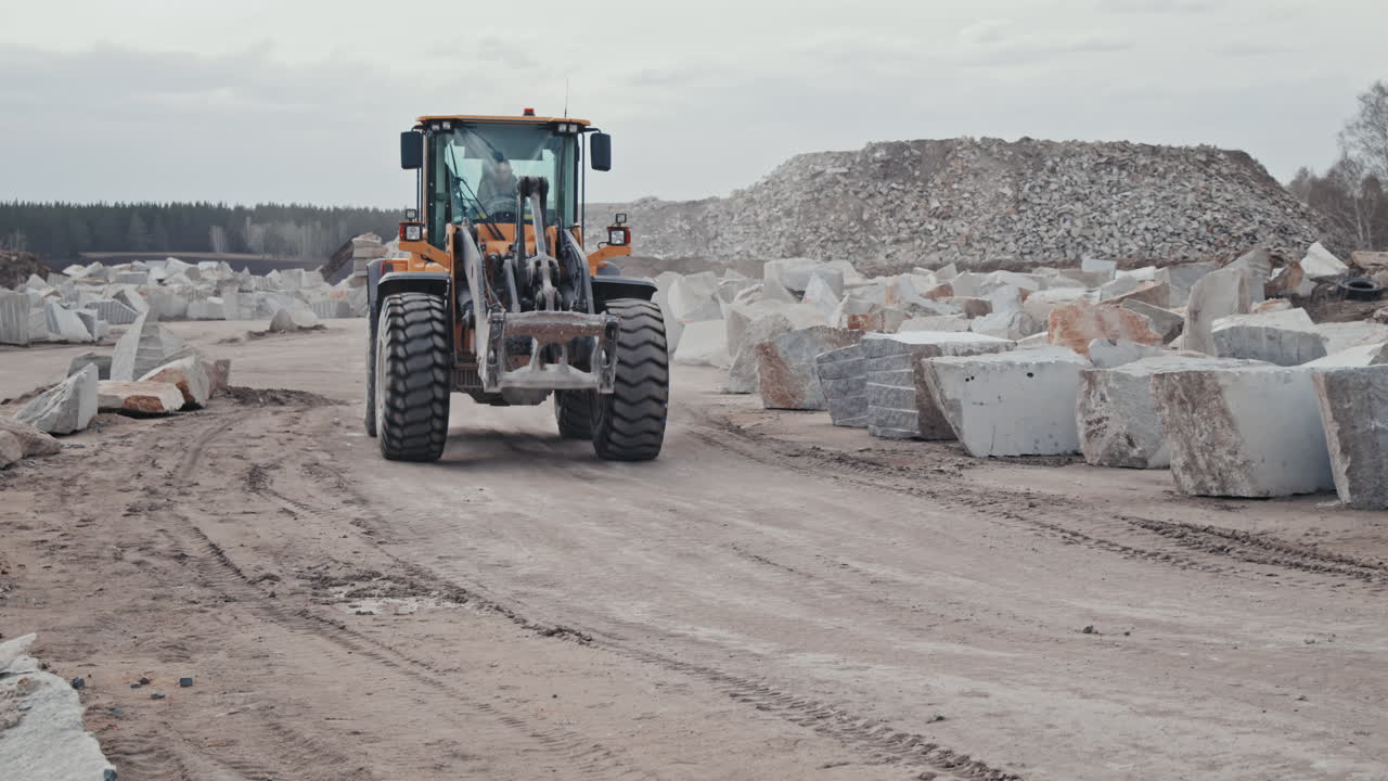Heavy Wheel Loader Driving in Quarry