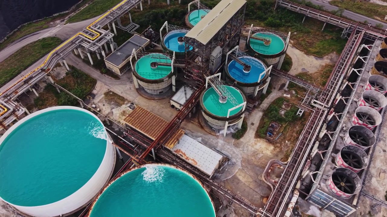 Water processing facility with large tanks and pipes in operation