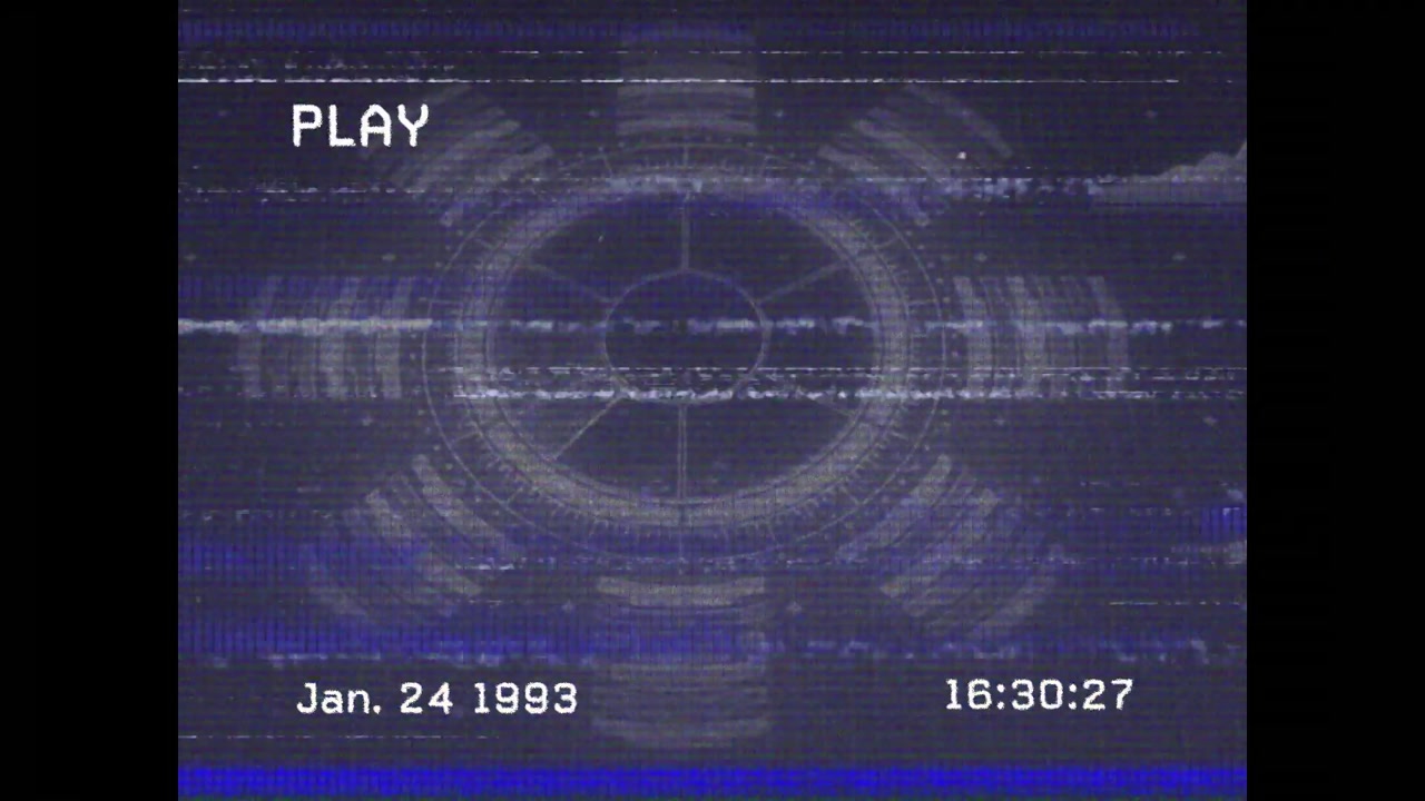 PLAY icon appearing over circle, timestamp counting each second and bands shifting for VHS effect