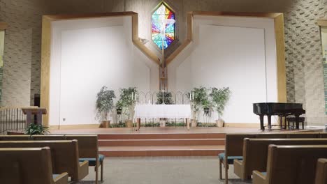 Smooth-gimbal-down-the-middle-of-a-Christian-Lutheran-chapel-church-isle-towards-altar