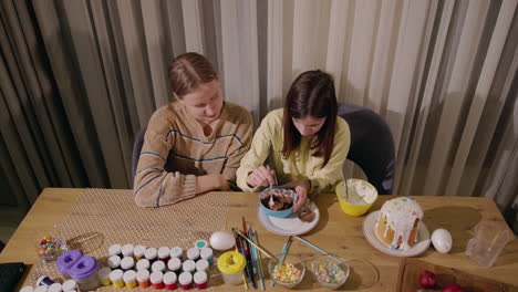 sisters decorating easter treats