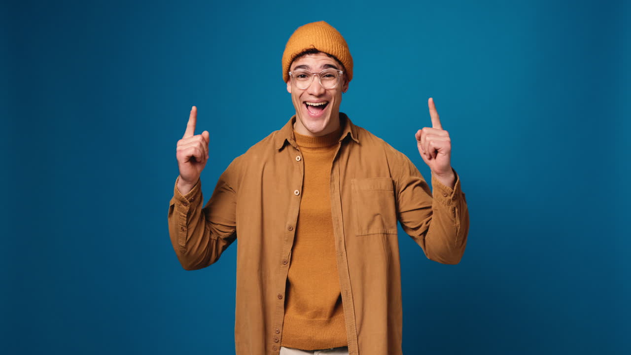 Excited man pointing upwards with a solution